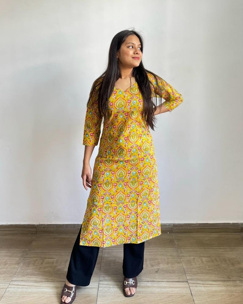 YELLOW MOTIFS LONG STRAiGHT KURTI